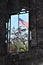 American flag seen beyond ruins of building