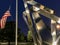 American flag by silver metal statute