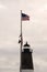 American Flag Waves Over Lighthouse