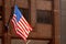 American flag waving on the building with skyscrapers New York US