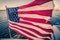 American flag waving on a rapid moving boat