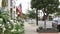 American flag waving, suburban house facade residential district, California USA