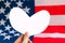 American flag and white mockup heart. National love concept.