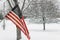 American Flag with winter snow background