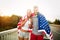 American flag - woman and man USA sport athlete winner cheering waving US flag