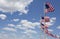 American flags against blue sky