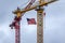 American Flags flying on construction cranes
