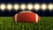 American football ball close up on field