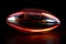 American football ball with a kinetic energy core, generating a pulsating glow, isolated on black background illustration