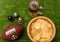 American football ball  little helmets  beer and chips