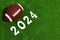 American football ball next to 2024 number