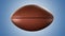 American football ball rotating in motion on blue screen. Looped American football 3d Animation. 3d. 4K