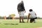 American Football coach training a young athlete.