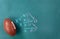American Football with game plan on green chalkboard