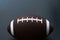 American football isolated on black background. Sport object concept