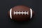 American football isolated on black background. Sport object concept