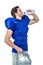 American football player holding helmet while drinking water