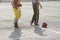 American football player, referee and helmet on the field