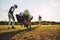 American football players doing tackling drills on a sports fiel