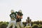 American football players practicing tackling on a sports field