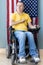 American freedom in wheelchair. USA flag