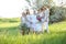 American granny standing with daughters, granddaughters and grand granddaughter outside.