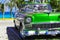 American green 1956 convertible vintage car on the beach in Varadero Cuba - Serie Cuba Reportage