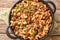 American Hamburger Goulash with Elbow Macaroni closeup in the pan. Horizontal top view