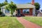 American house exterior with brick and clapboard siding trim