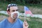 American man with broken surgical mask