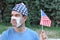 American man with broken surgical mask