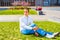 American Man Relaxing on Green Lawn in New York