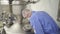 American man scientist working with equipment at workspace in medical factory.