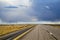 American midwest empty highway under dramatic sky