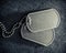 American military dog tags. Rough and worn with blank space for text. Memorial Day or Veterans Day concept