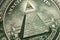 American money, illuminati and mystical symbols concept with macro close up on the all seeing eyeball atop the pyramid on the back