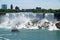 American Niagara Falls waterfall view with a touristic vessel Maid of the Mist in front. The falls height is 57 m and