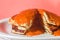 American pancakes on the plate with orange background, guava jam, copy space and jam in abundance