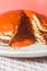 American pancakes on the plate with orange background, guava jam, copy space and jam in abundance