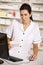 American pharmacist using computer in pharmacy