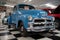 American pickup truck from the 50s, it is a blue Chevrolet Advance Design