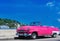 American pink Cabriolet Oldtimer parked on the Malecon in Havana Cuba - Serie Kuba 2016 Reportage