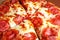 American Pizza closeup. Cheese salami sausage texture. Food photo.