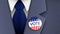American politician wearing VOTE pin on a blue color official suit, vector illustration.