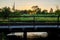 American railroad bridge in countryside at sunset