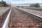 American railway with oak cross beams against a stone gravel