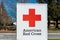 American Red Cross sign. American Red Cross is a humanitarian organization that provides emergency assistance, disaster relief,