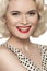 American retro style. Beautiful laughing woman model with old fashioned make-up, blond hair, happy smile