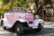 American rose Ford convertible classic car parked under palms in Varadero Cuba - Serie Cuba Reportage