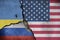 the american, russian and ukranian flag on concrete wall.